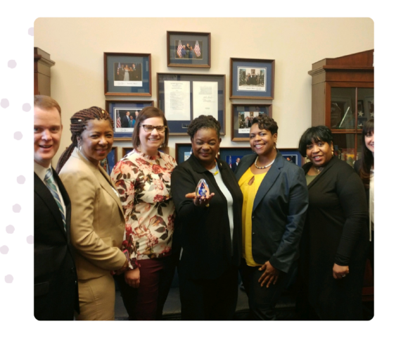 Image of Progressive staff and board members at a congressional meeting