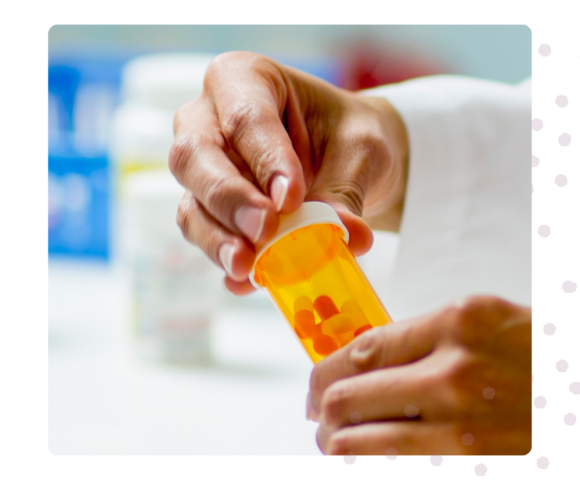 hands holding pill bottle